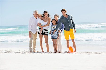simsearch:614-06002173,k - Multi-generation family standing on the beach taking selfie Stock Photo - Premium Royalty-Free, Code: 6108-08663064