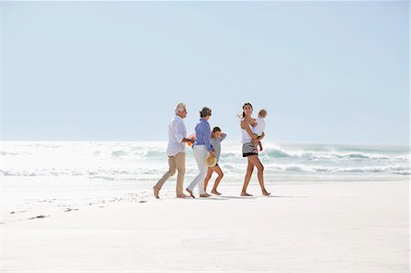 simsearch:614-06002173,k - Multi-generation family walking on the beach Stock Photo - Premium Royalty-Free, Code: 6108-08663077