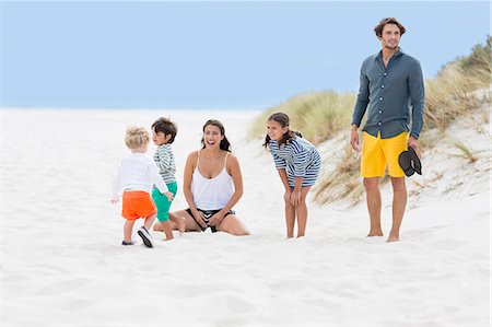 Family enjoying on the beach Stock Photo - Premium Royalty-Free, Code: 6108-08663306
