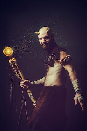 Creature holding a magic stick Stock Photo - Premium Royalty-Free, Code: 6108-08637029