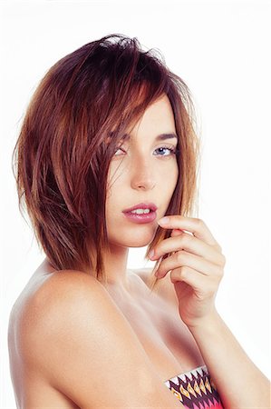 simsearch:6108-08637407,k - Portrait of a young woman in profile sensual look, the hand near the mouth Stock Photo - Premium Royalty-Free, Code: 6108-08637263