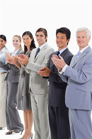 simsearch:6109-06002816,k - Multicultural smiling business people applauding and posing against white background Stock Photo - Premium Royalty-Free, Code: 6109-06002767