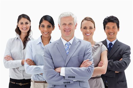 simsearch:6109-06002816,k - Close-up of a smiling multicultural business team behind their boss against white background Stock Photo - Premium Royalty-Free, Code: 6109-06002703