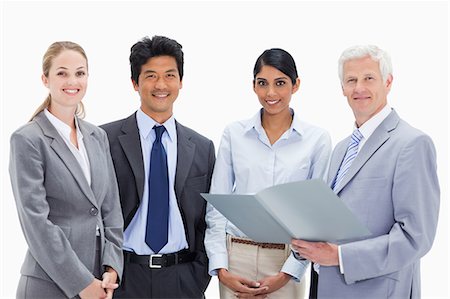 simsearch:6109-06002816,k - Boss with his smiling employees holding a file against white background Stock Photo - Premium Royalty-Free, Code: 6109-06002852