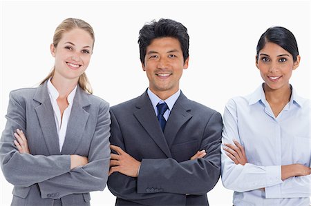 simsearch:6109-06002816,k - Smiling business people with their arms folded against white background Stock Photo - Premium Royalty-Free, Code: 6109-06002855
