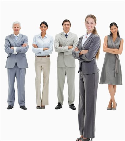 simsearch:6109-06002816,k - Blonde woman with business people smiling behind her against white background Stock Photo - Premium Royalty-Free, Code: 6109-06002801