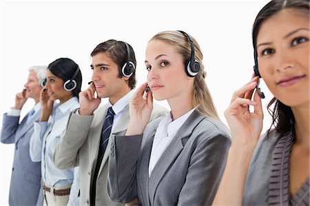 simsearch:6109-06002816,k - Professionals listening carefully with headsets against white background Stock Photo - Premium Royalty-Free, Code: 6109-06002815