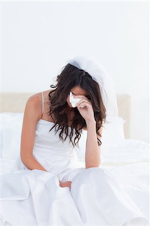 people kleenex - Sad bribe sitting while crying in her bedroom Stock Photo - Premium Royalty-Free, Code: 6109-06003375