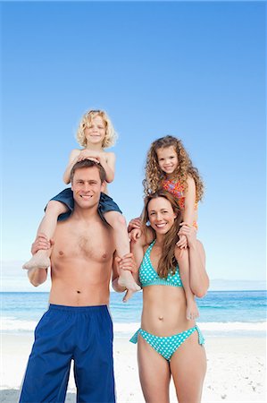 simsearch:6109-06003758,k - Cheerful young family having a nice day on the beach Stock Photo - Premium Royalty-Free, Code: 6109-06003643