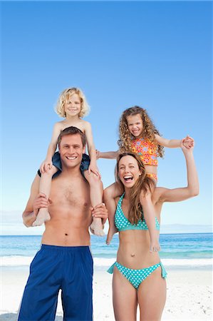 simsearch:6109-06003758,k - Happy young family spending a nice day on the beach Stock Photo - Premium Royalty-Free, Code: 6109-06003644