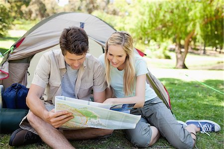 simsearch:6109-06003893,k - A camping couple look at a map to find where they are Stock Photo - Premium Royalty-Free, Code: 6109-06003871