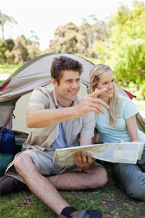 simsearch:6109-06003893,k - A close up shot of a man and his girlfriend camping while looking over at something in the distance Stock Photo - Premium Royalty-Free, Code: 6109-06003874