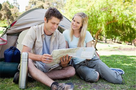 simsearch:6109-06003893,k - A couple camp out together while the map checks the map and the woman looks at him Stock Photo - Premium Royalty-Free, Code: 6109-06003880