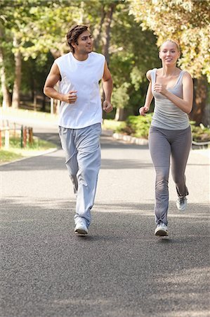 Young sportspeople jogging on a street Stock Photo - Premium Royalty-Free, Code: 6109-06004565