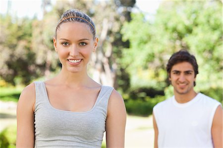 Smiling sportspeople standing in the park Stock Photo - Premium Royalty-Free, Code: 6109-06004533