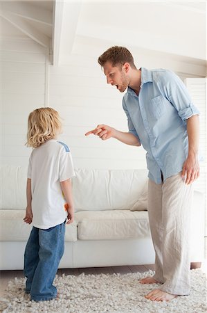 punishment - A father is giving out to his son for doing something bad. Stock Photo - Premium Royalty-Free, Code: 6109-06005130