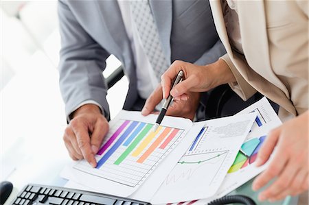 diagrammatic - Two business people working on figures in an office Stock Photo - Premium Royalty-Free, Code: 6109-06005261