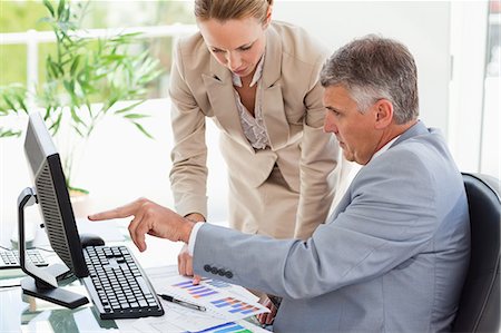 statistic - Company people having a conversation about figures in a bright office Stock Photo - Premium Royalty-Free, Code: 6109-06005288