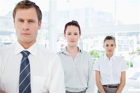 Young salesteam standing in a row Stock Photo - Premium Royalty-Free, Code: 6109-06005774