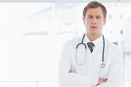 simsearch:6109-06005907,k - Male doctor with his arms folded Stock Photo - Premium Royalty-Free, Code: 6109-06005868