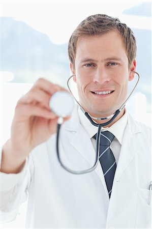 simsearch:6109-06005907,k - Smiling doctor with his stethoscope Stock Photo - Premium Royalty-Free, Code: 6109-06005893