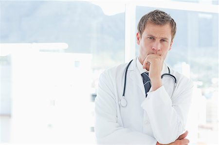 simsearch:6109-06005907,k - Young doctor in thinkers pose Stock Photo - Premium Royalty-Free, Code: 6109-06005895