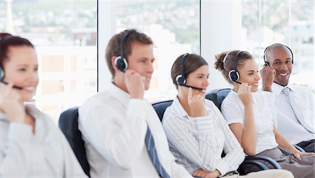 Young call center agents at work Stock Photo - Premium Royalty-Free, Code: 6109-06005805