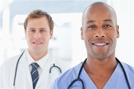 simsearch:6109-06005907,k - Young male doctors standing in line Stock Photo - Premium Royalty-Free, Code: 6109-06005903