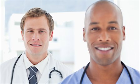 simsearch:6109-06005907,k - Young male doctors standing in arow Stock Photo - Premium Royalty-Free, Code: 6109-06005902