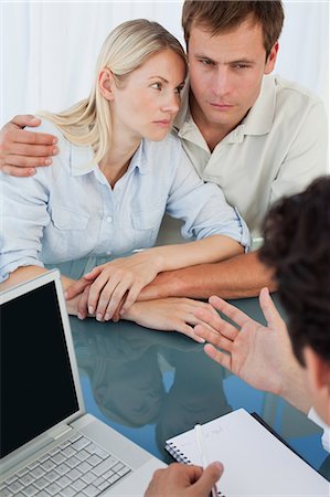 patient and doctor consultation desk - Disappointed young couple getting bad news from their doctor Stock Photo - Premium Royalty-Free, Code: 6109-06006661