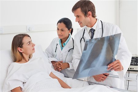 simsearch:6109-06006928,k - Serious patient listening to surgeons talking about a chest x-ray Stock Photo - Premium Royalty-Free, Code: 6109-06007042