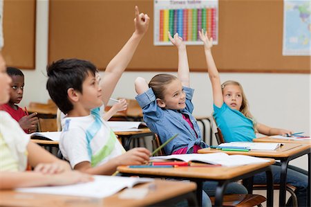 school desk - Side view of students raising their hands Stock Photo - Premium Royalty-Free, Code: 6109-06007465