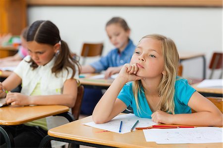 simsearch:6109-06007455,k - Little girl in class doesn't seem very focused Stock Photo - Premium Royalty-Free, Code: 6109-06007493