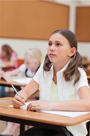 simsearch:6109-06007455,k - Primary school student sitting at her desk Stock Photo - Premium Royalty-Free, Code: 6109-06007419