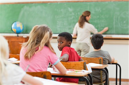 simsearch:6109-06007455,k - Elementary students talking during class Stock Photo - Premium Royalty-Free, Code: 6109-06007537