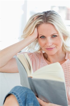 female alone casual smiling mid adult - Blonde female with a book Stock Photo - Premium Royalty-Free, Code: 6109-06194285