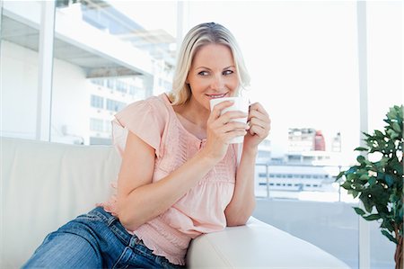 Smiling blonde with a coffee Stock Photo - Premium Royalty-Free, Code: 6109-06195062