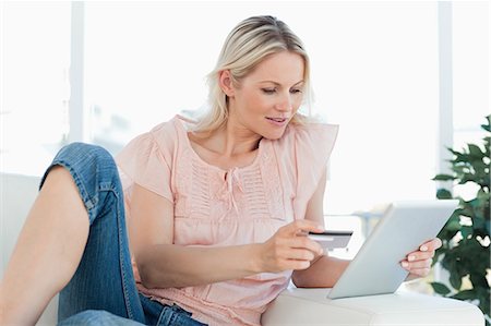 people holding cards in hand - Blonde woman buying online with a touchpad Stock Photo - Premium Royalty-Free, Code: 6109-06195028