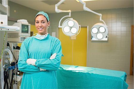 Nurse smiling with arms crossed Stock Photo - Premium Royalty-Free, Code: 6109-06195786