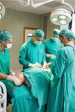 female patient operating table - Female patient undergoing surgery Stock Photo - Premium Royalty-Free, Code: 6109-06195845