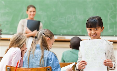 Student with her exercise book in classroom Stock Photo - Premium Royalty-Free, Code: 6109-06196463