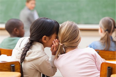 schoolgirl - Students chatting during class Stock Photo - Premium Royalty-Free, Code: 6109-06196479