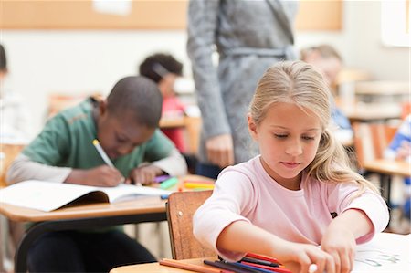 simsearch:6109-06196438,k - Elementary class writing a test Stock Photo - Premium Royalty-Free, Code: 6109-06196493