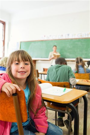 Girl turned around during lesson Stock Photo - Premium Royalty-Free, Code: 6109-06196423
