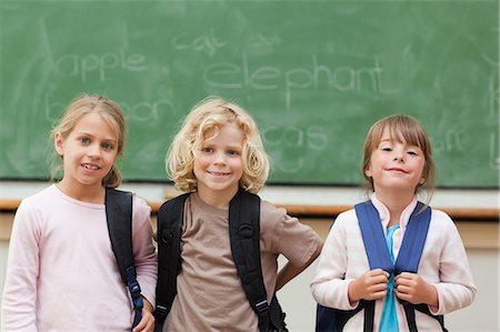 primary school student - Students with backpacks ready to leave school Stock Photo - Premium Royalty-Free, Code: 6109-06196566