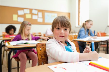 Girl drawing during class Stock Photo - Premium Royalty-Free, Code: 6109-06196524