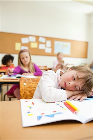 sleeping student in class room images - Girl sleeping on her drawing book Stock Photo - Premium Royalty-Free, Code: 6109-06196528