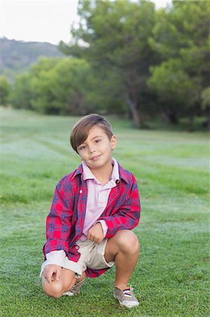 polo shirt - Cute boy in the park Stock Photo - Premium Royalty-Free, Code: 6109-06684745