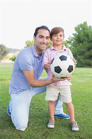 soccer dad - Father and son with a football Stock Photo - Premium Royalty-Free, Code: 6109-06684770