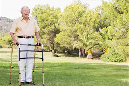 Portrait of old man using zimmer frame Stock Photo - Premium Royalty-Free, Code: 6109-06684843
